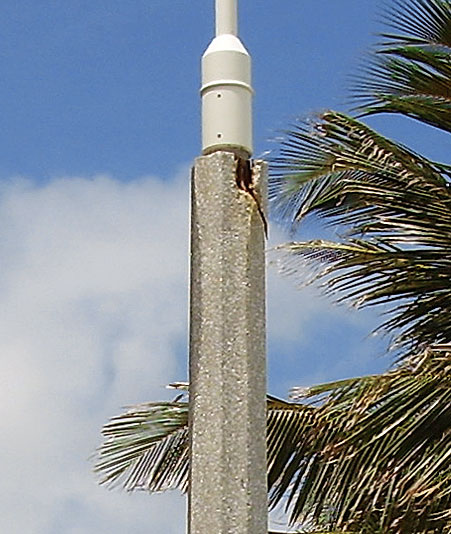 severely chipped concrete light pole