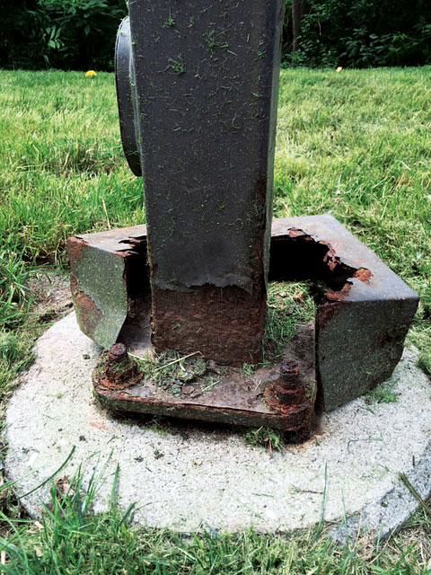 rusted steel base on a street pole